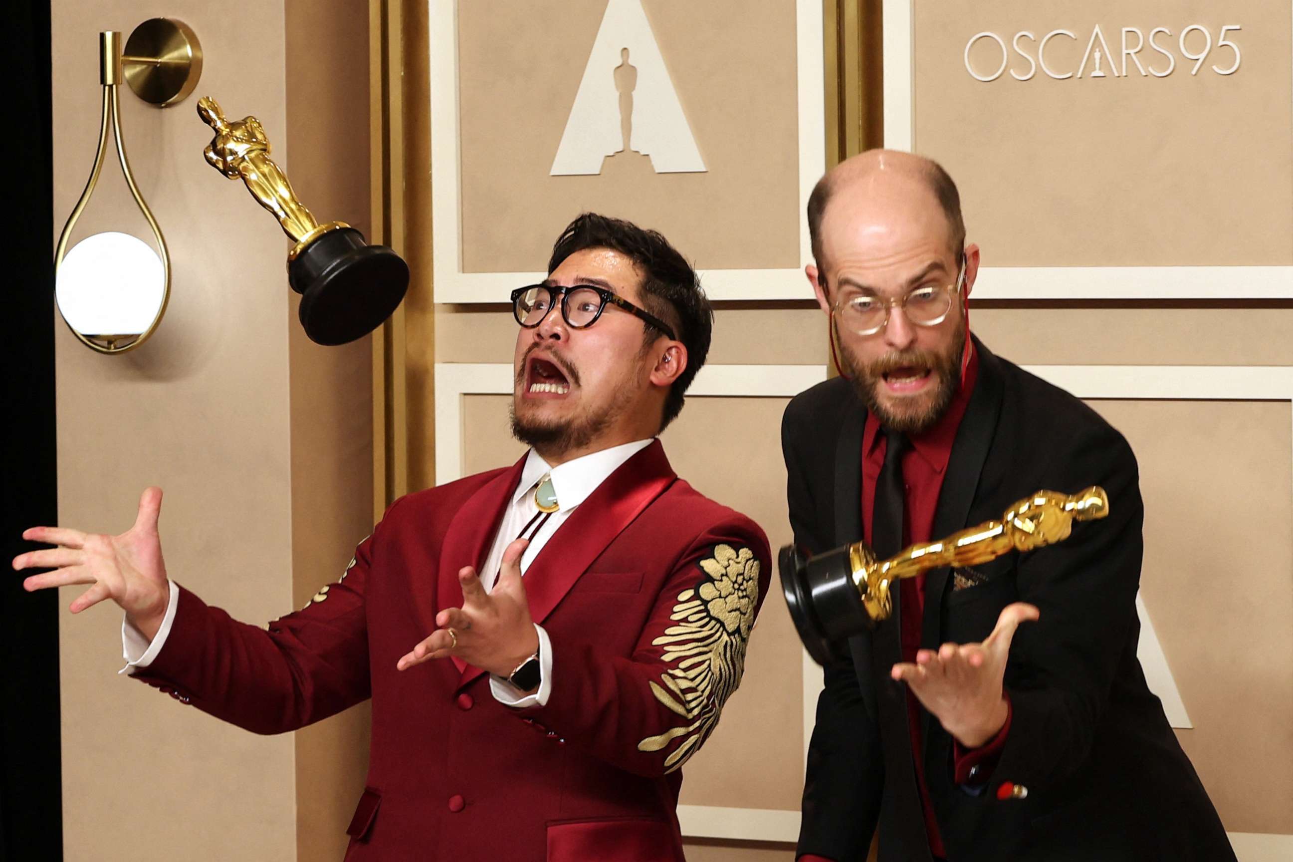 PHOTO: Directors Daniel Kwan and Daniel Scheinert pose with their Oscar for Best Picture for "Everything Everywhere All at Once" at the 95th Academy Awards in Hollywood, Mar. 12, 2023.