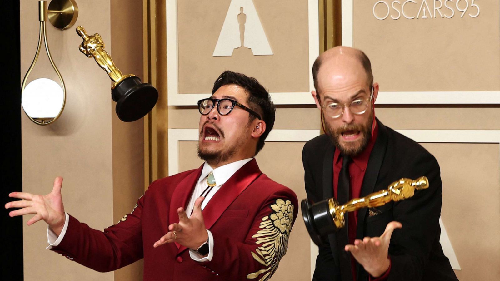 PHOTO: Directors Daniel Kwan and Daniel Scheinert pose with their Oscar for Best Picture for "Everything Everywhere All at Once" at the 95th Academy Awards in Hollywood, Mar. 12, 2023.