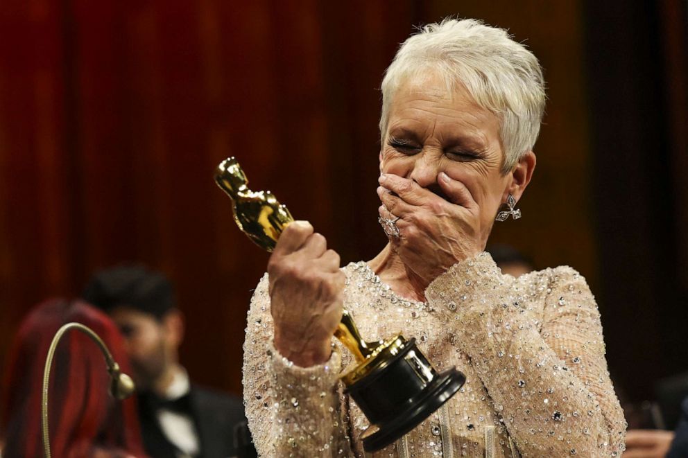 PHOTO: Best Supporting Actress Jamie Lee Curtis reacts while holding her Oscar at the Governors Ball following the 95th Academy Awards in Hollywood, Mar. 12, 2023.