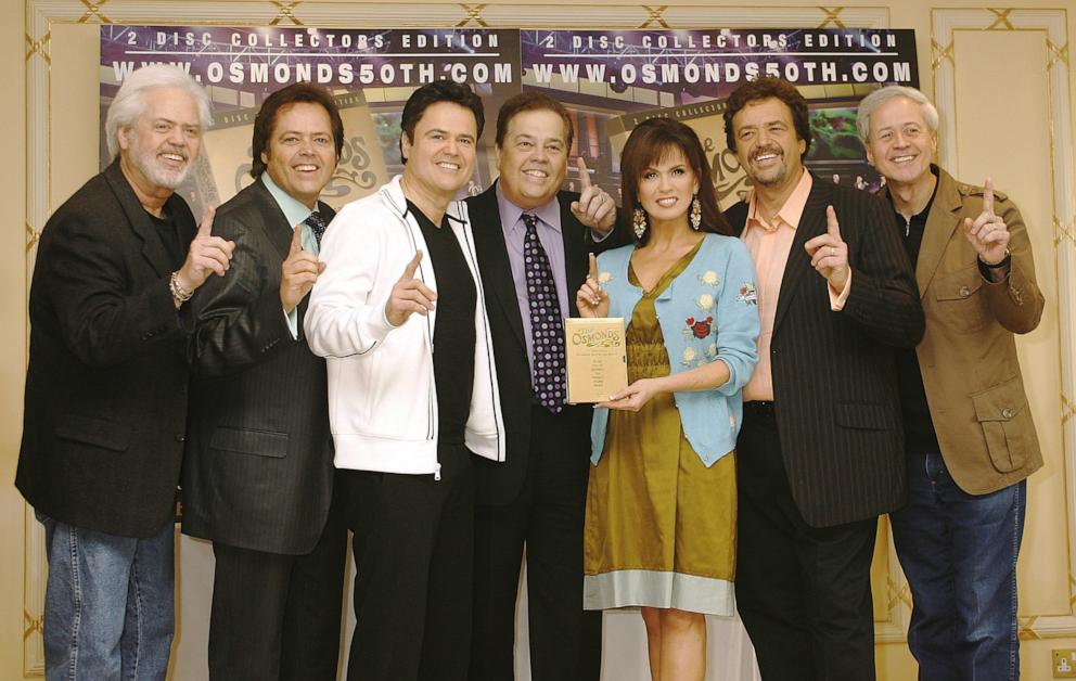 PHOTO: In this May 29, 2008 file photo, (L-R) Merrill Osmond, Jimmy Osmond, Donny Osmond, Alan Osmond, Marie Osmond, Jay Osmond and Wayne Osmond pose for a photo together in London.