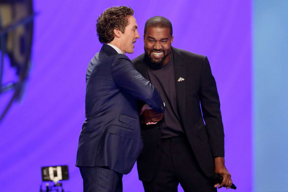 PHOTO: Kanye West, right, shakes hands with  Joel Osteen during a service at Lakewood Church, Nov. 17, 2019, in Houston.  