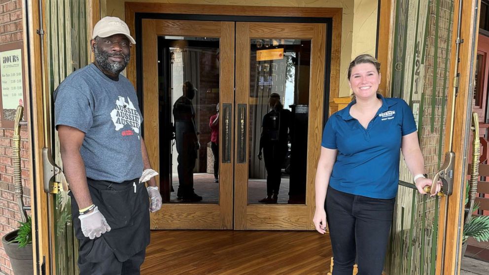 PHOTO: Kenneth Smith, 50, pictured outside of an Outback Steakhouse in Forth Worth, Texas, with Laura Hodges, 33.