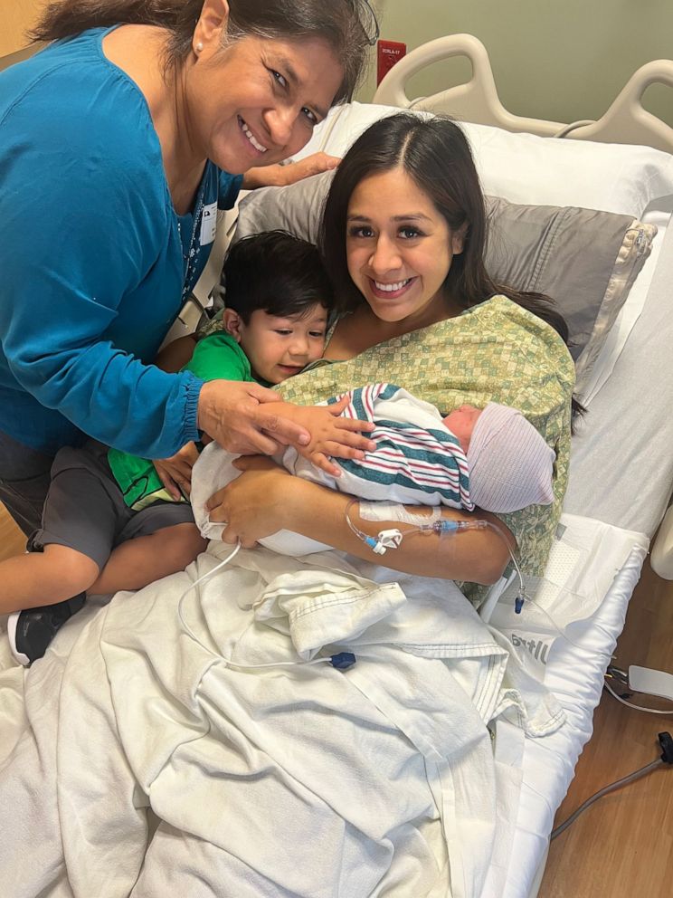 PHOTO: Krystina Pacheco poses with her son and newborn daughter and a relative after giving birth on Oct. 24, 2022.