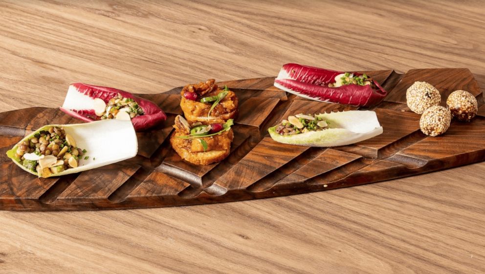 PHOTO: Lentil salad on a leaf of endive, butternut squash toasts and almond date bites.