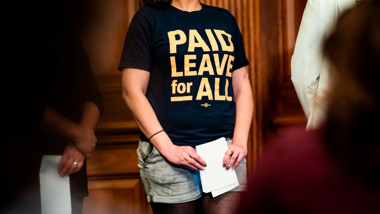 PHOTO: In this March 15, 2022 file photo, Bethany Fauteux, a member of Paid Leave for All's Voices of Workers Advisory Group wears a t-shirt reading "Paid Leave for All" during an Equal Pay Day event on Capitol Hill in Washington.