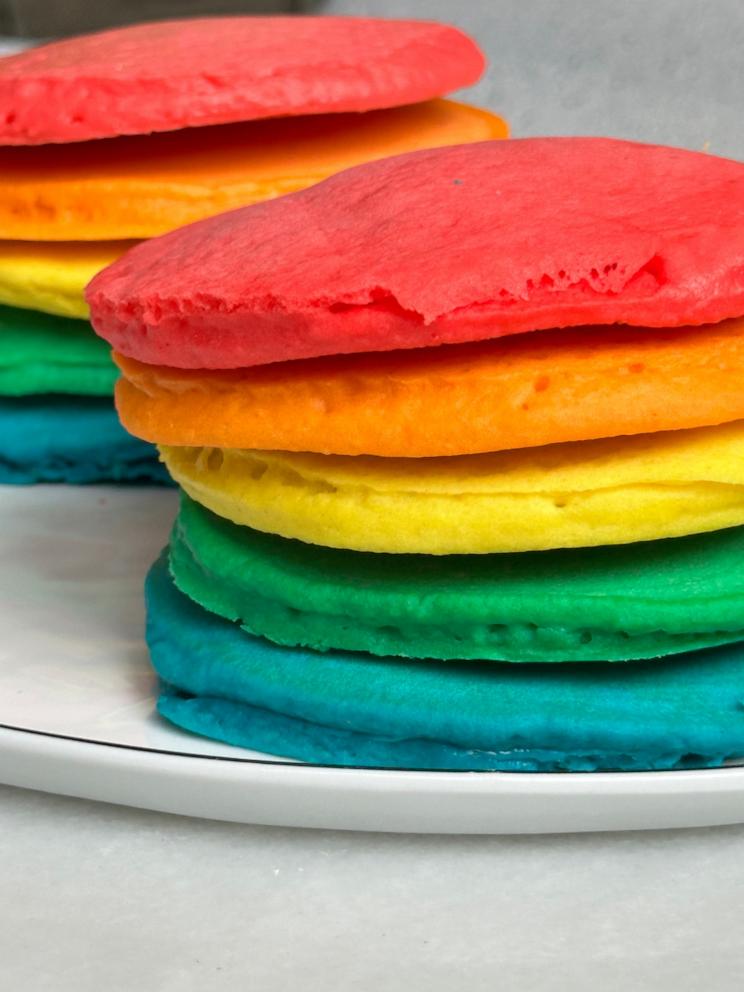 PHOTO: A short stack of rainbow colored pancakes.