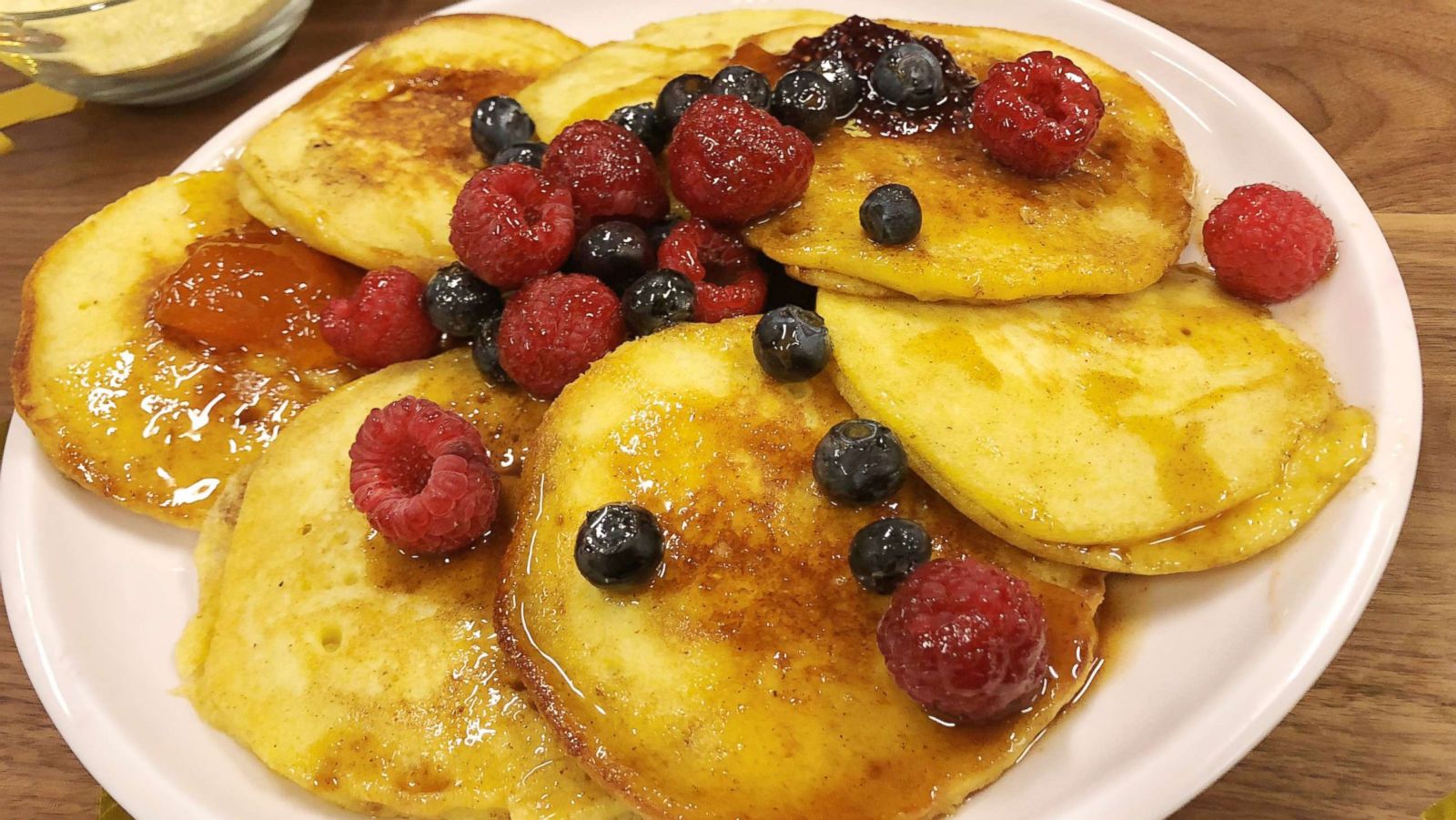 PHOTO: Alex Guarnaschelli's cornmeal buttermilk pancakes with spiced maple syrup and fresh berries.