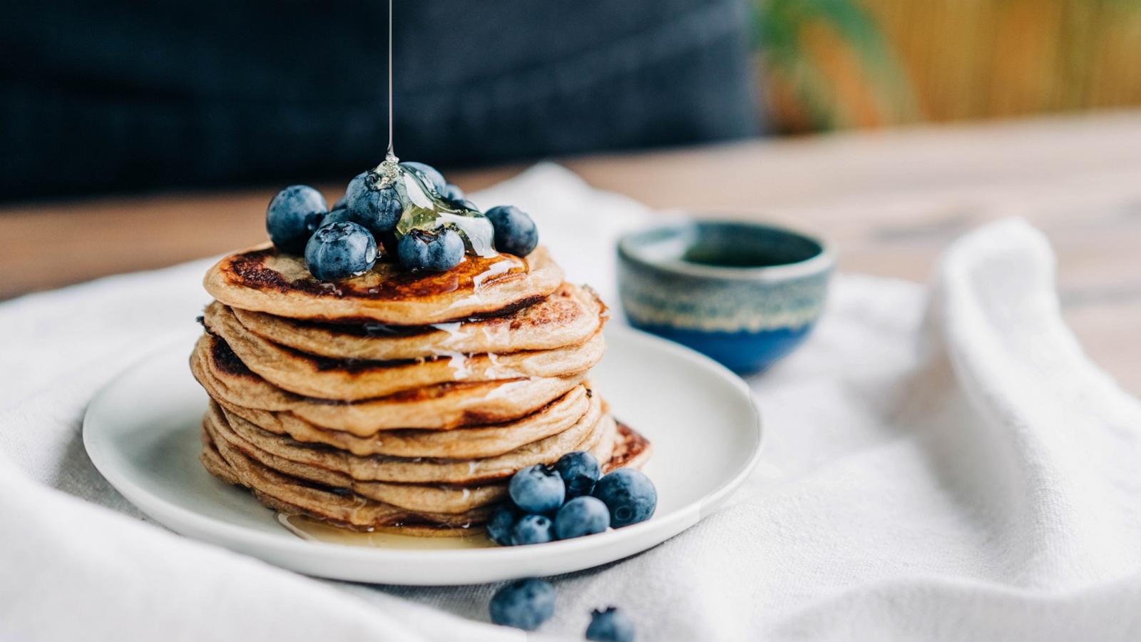 Pancakes with blueberries and honey.