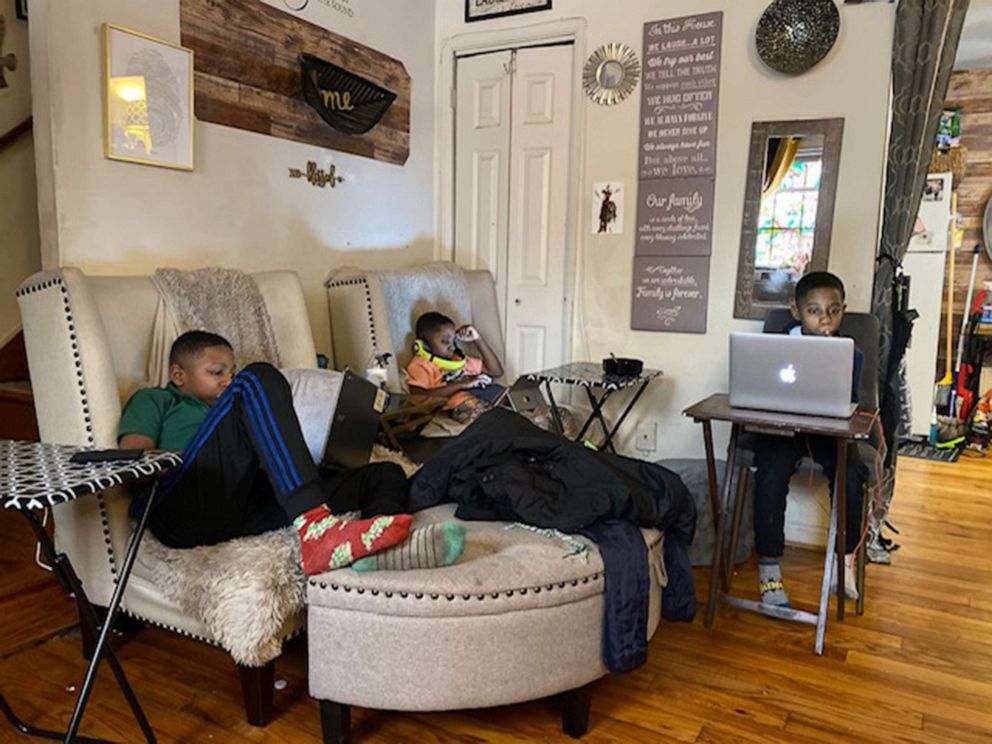 PHOTO: Twins Elias and Josiah Stewart and their older brother take online classes at home.
