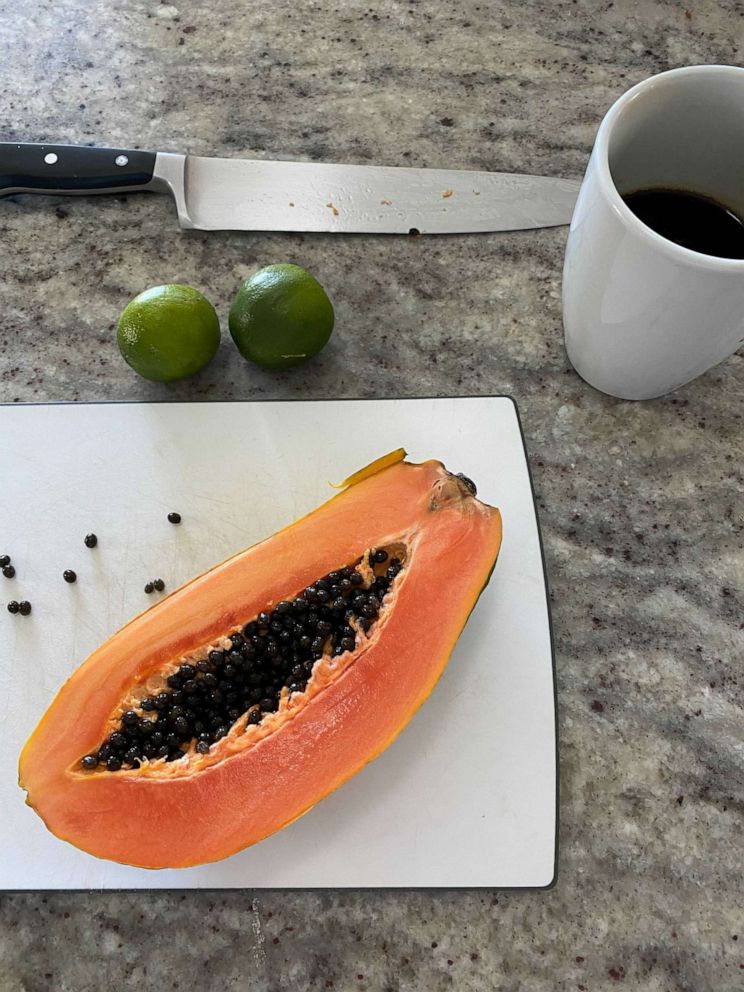 PHOTO: A medium everyday plastic cutting board used to slice fresh papaya and citrus.