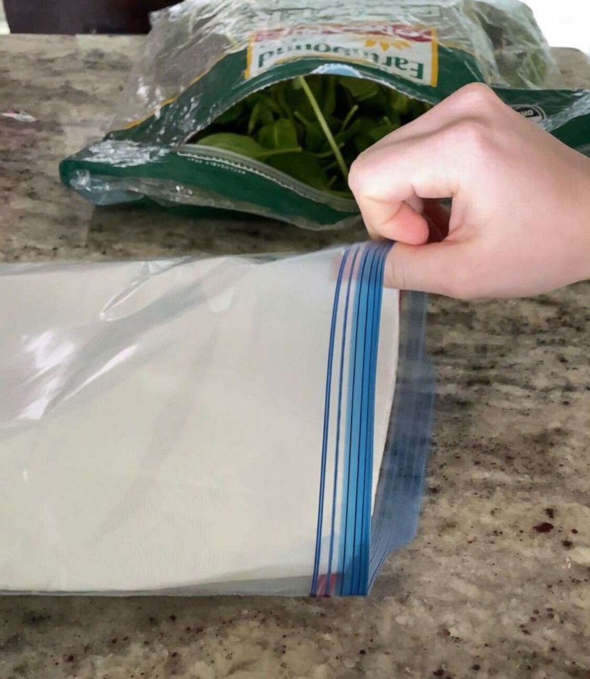 PHOTO: Use a paper towel to absorb moisture in a bag of greens.