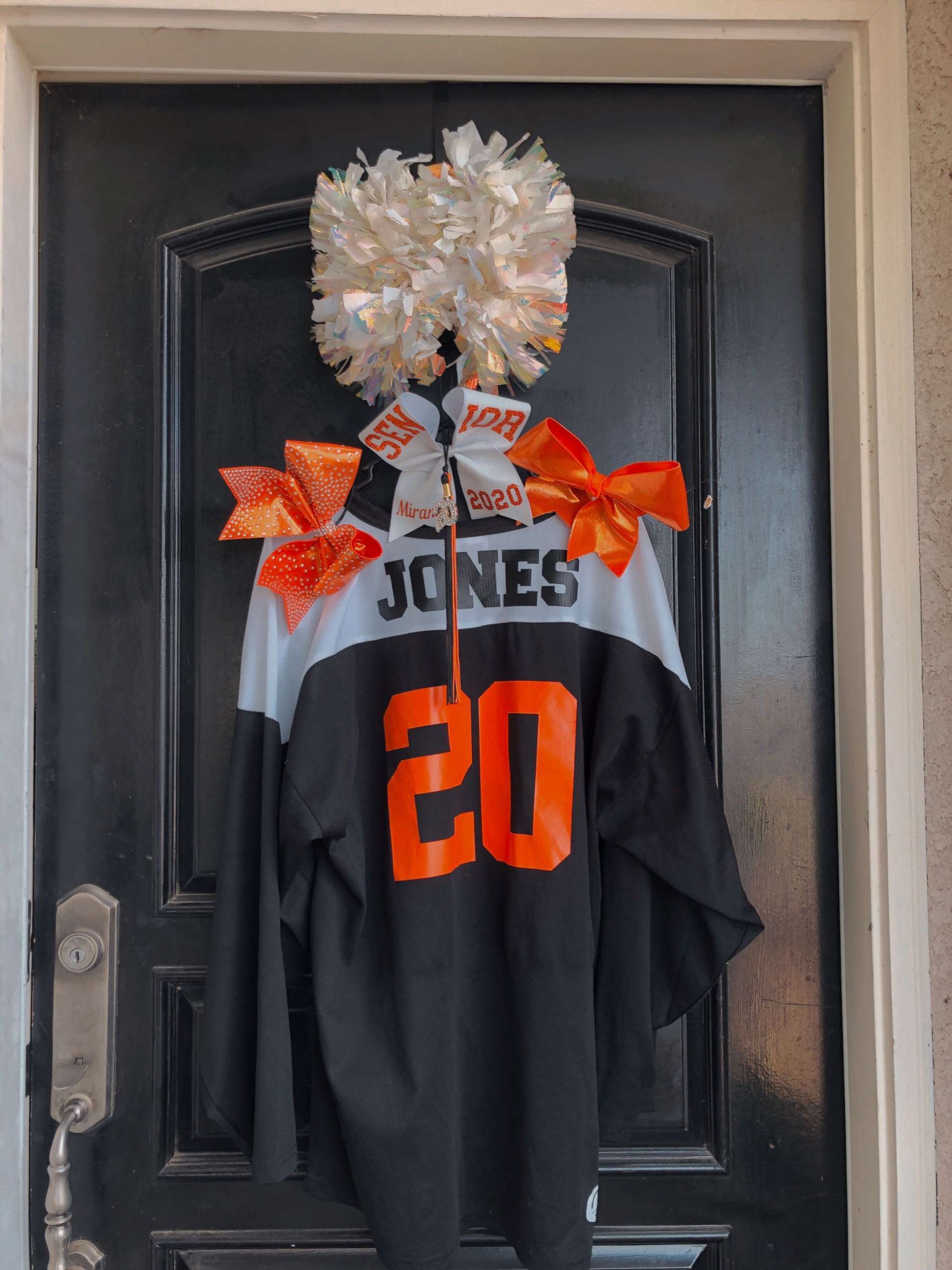 PHOTO: Central High School East senior Miranda Jones' cheerleading jersey hangs on her front door in Fresno, California.