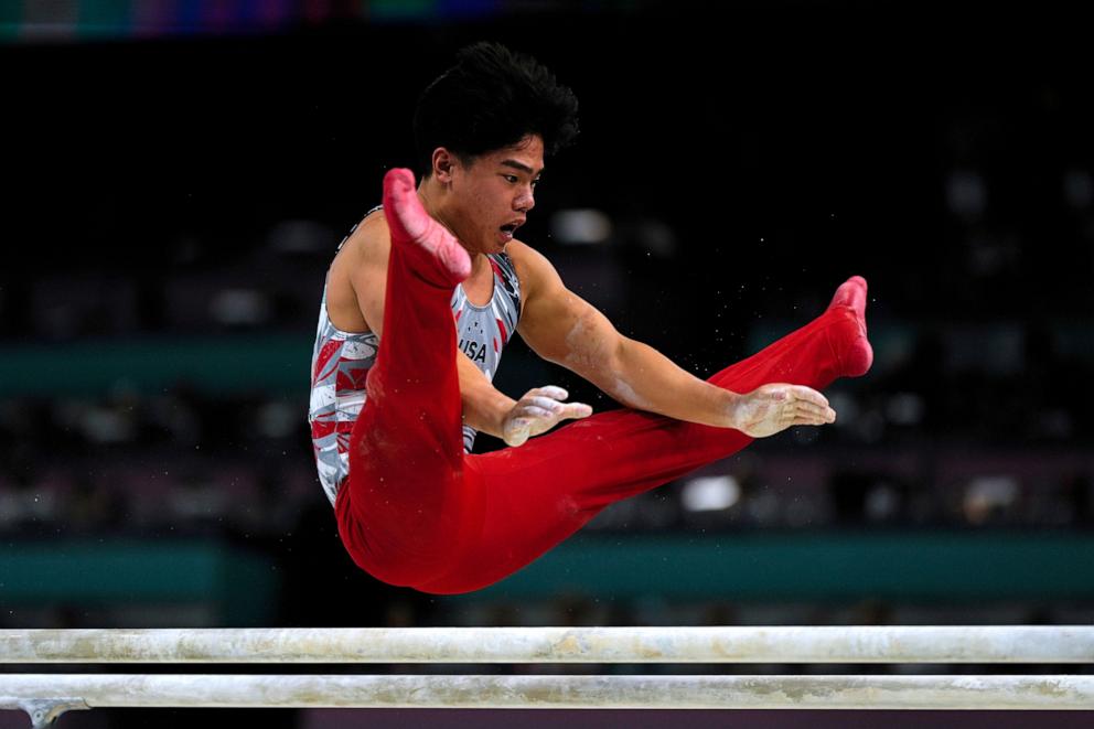 PHOTO: Asher Hong, of the U.S performs on the parallel bars during the men's artistic gymnastics team finals at the 2024 Paris Olympics, July 29, 2024.