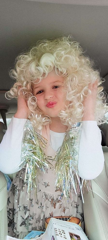 PHOTO: Troglen said she helped make her daughter's Dolly Parton costume with a store-bought blond wig and a white shirt modified with a birthday party banner.
