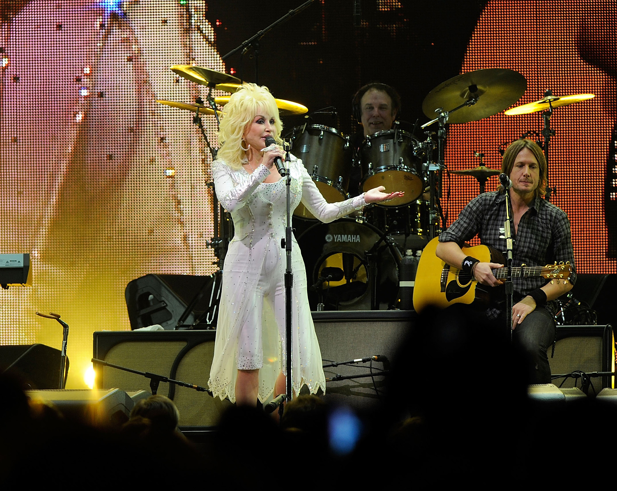PHOTO: Dolly Parton and Keith Urban perform onstage at the 2010 We're All For The Hall benefit concert at the Bridgestone Arena on Oct. 5, 2010, in Nashville, Tenn.