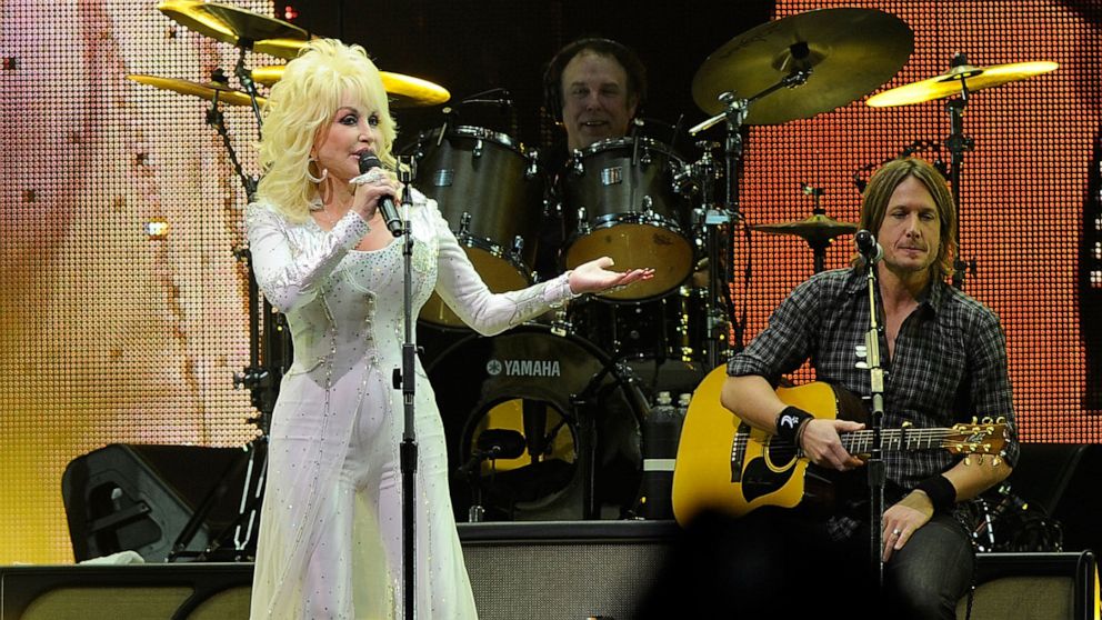 PHOTO: Dolly Parton and Keith Urban perform onstage at the 2010 We're All For The Hall benefit concert at the Bridgestone Arena on Oct. 5, 2010, in Nashville, Tenn.