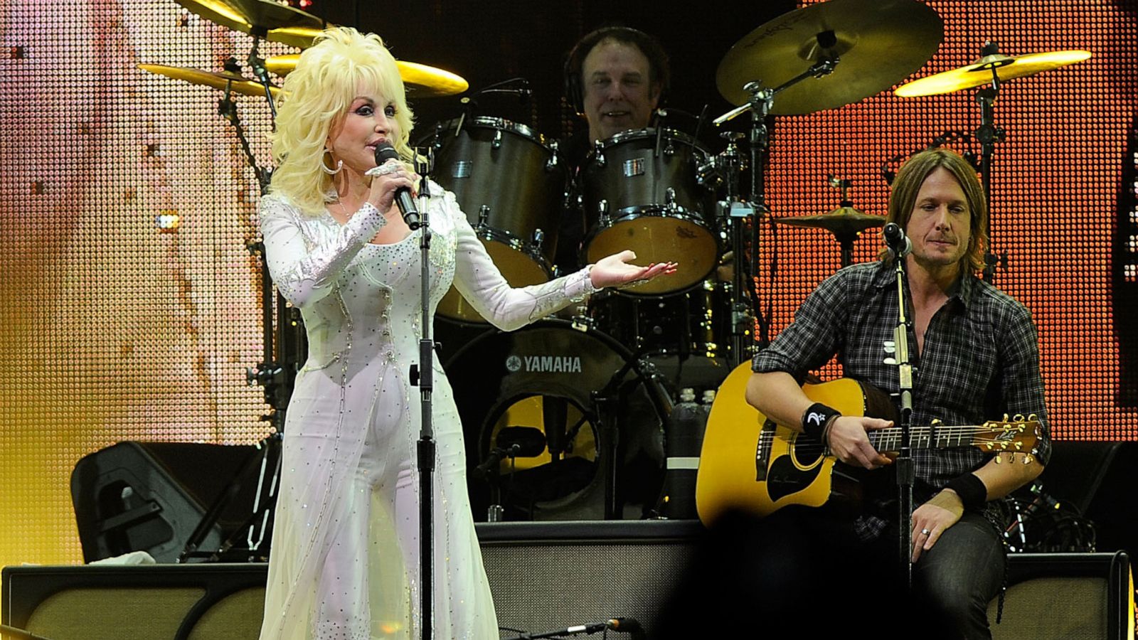 PHOTO: Dolly Parton and Keith Urban perform onstage at the 2010 We're All For The Hall benefit concert at the Bridgestone Arena on Oct. 5, 2010, in Nashville, Tenn.