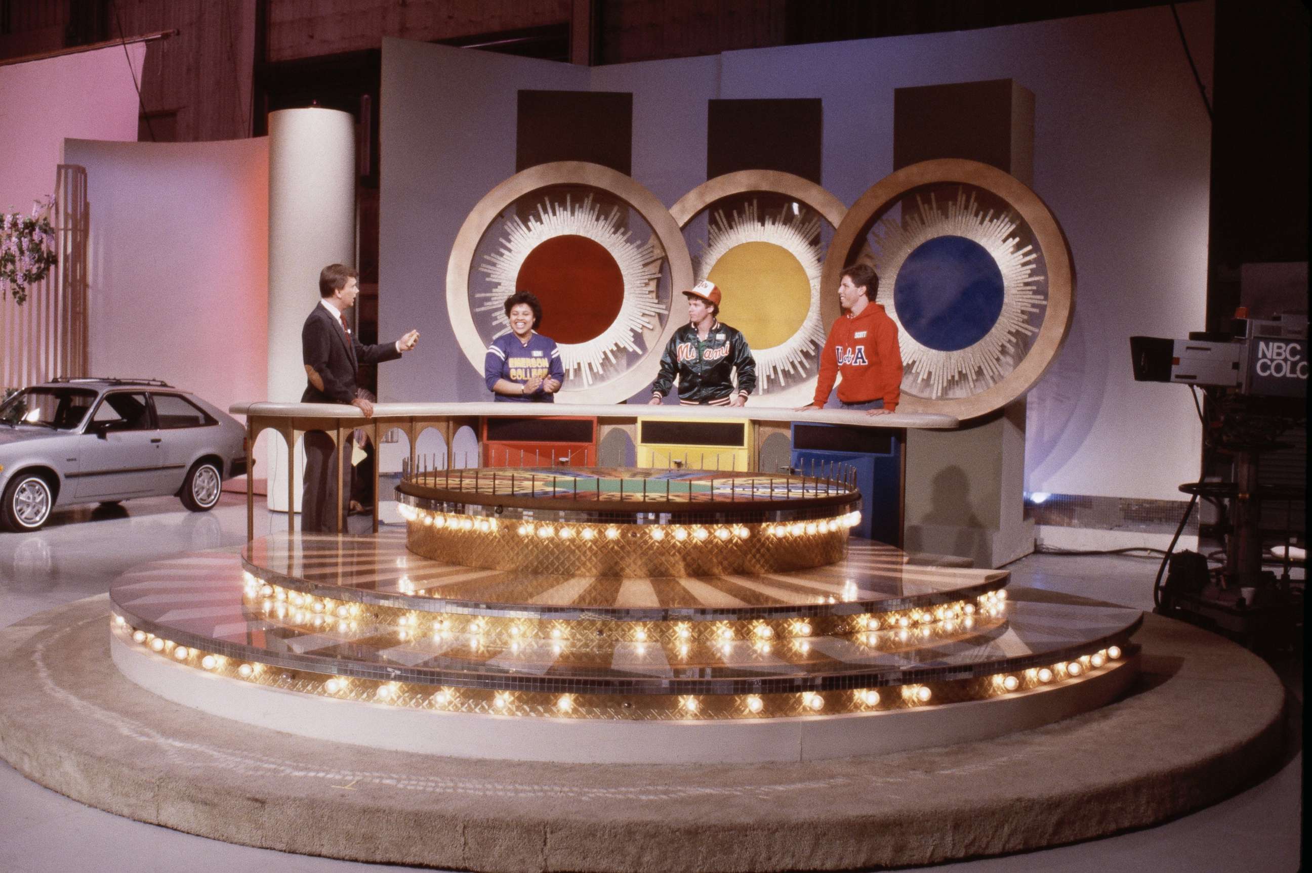 PHOTO: Pat Sajak with unknown contestants on the Wheel of Fortune in the 1980s.