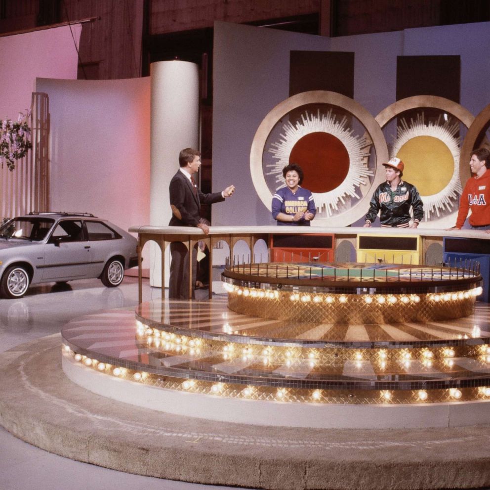 PHOTO: Pat Sajak with unknown contestants on the Wheel of Fortune in the 1980s.