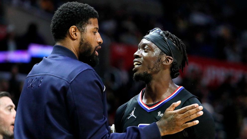 PHOTO: FILE - Paul George congratulates Clippers teammate Reggie Jackson for scoring 36 points leading the way to a 132-111 win over the Lakers at Crypto.Com Arena.