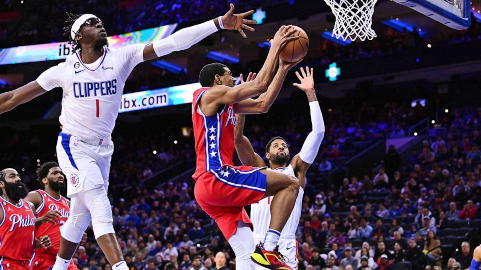 PHOTO: Philadelphia 76ers guard De'Anthony Melton (8) shoots against Los Angeles Clippers guard Reggie Jackson (1) and forward Paul George (13) in the first quarter at Wells Fargo Center.