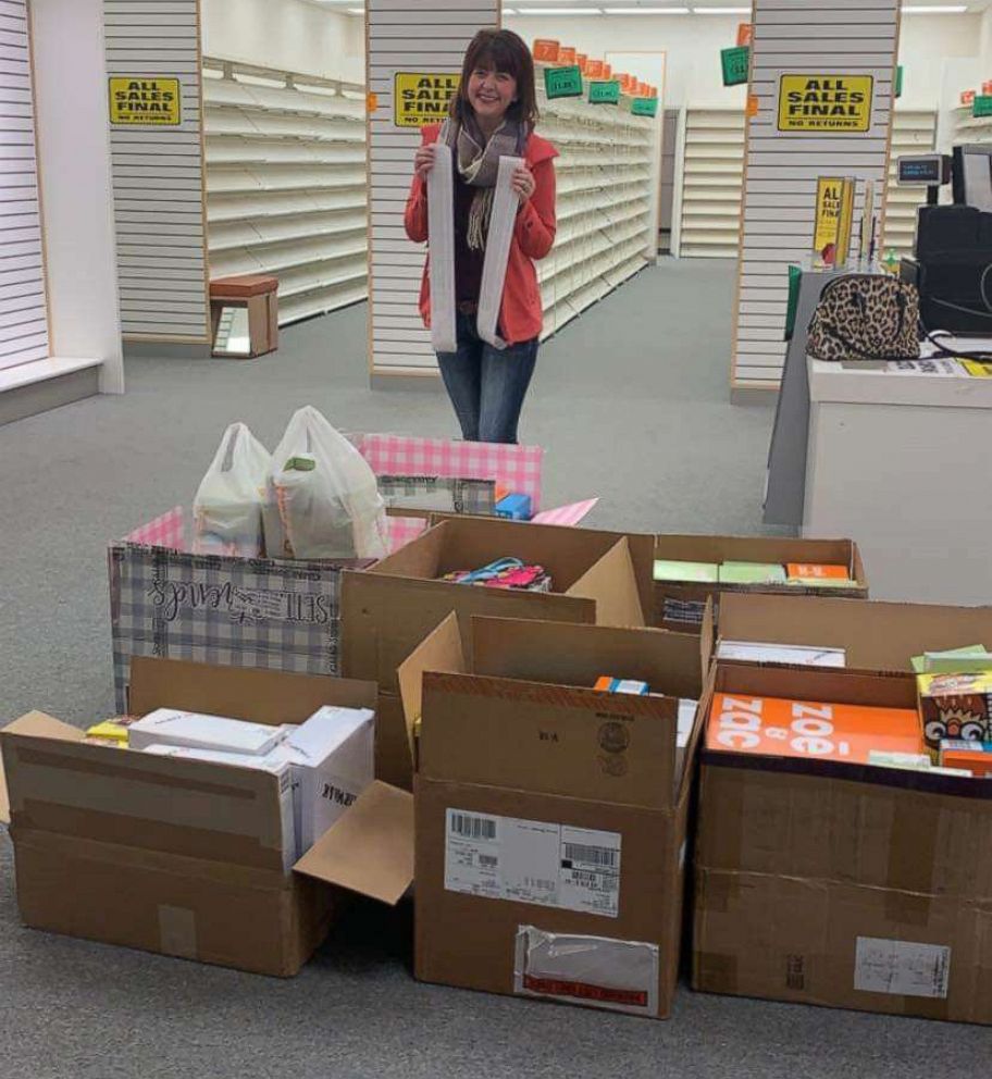 PHOTO: Addy Tritt, 25, poses at the Payless store where she bought the store's remaining shoes.