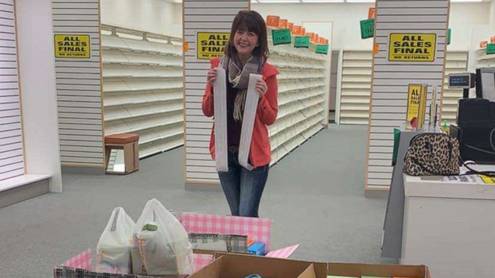 Addy Tritt, 25, poses at the Payless store where she bought the store's remaining shoes.