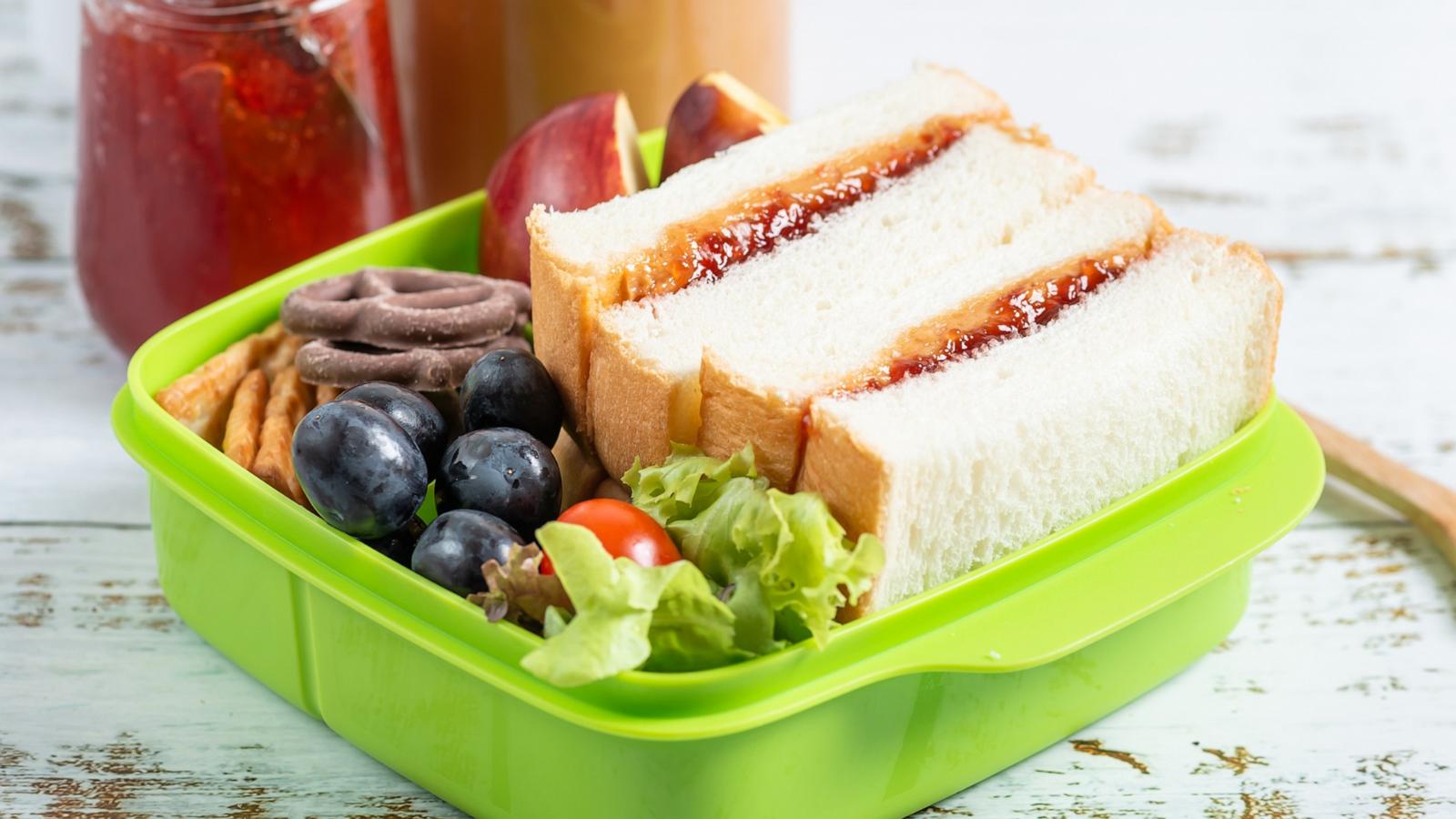 PHOTO: Lunch box of peanut butter with strawberry jam sandwich with crackers and fruit.