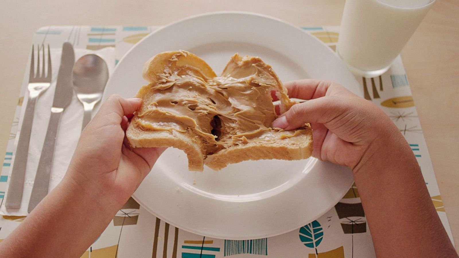 PHOTO: In an undated stock photo, a kid is seen pulling apart a peanut butter sandwich.