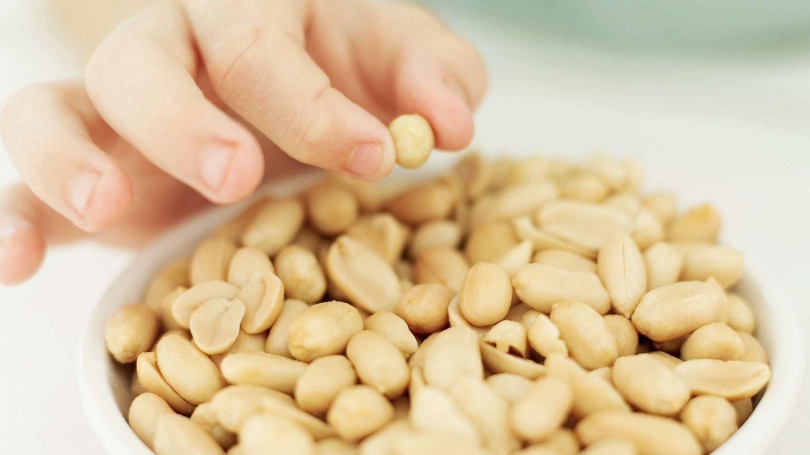 PHOTO: A child picks up a peanut in an undated stock photo.