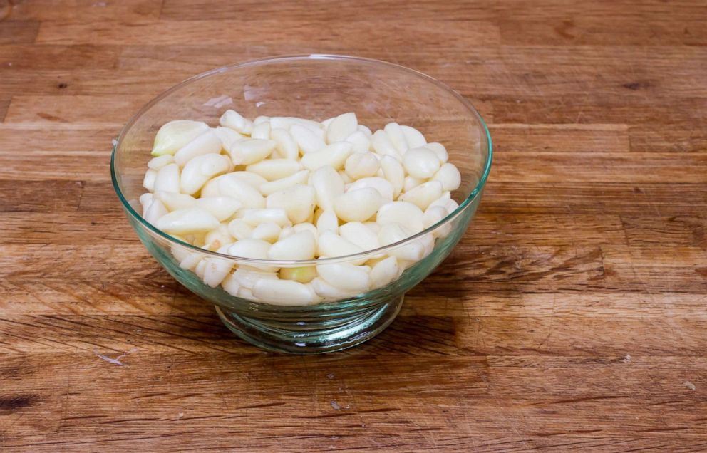 PHOTO: Peeled garlic cloves in a bowl.