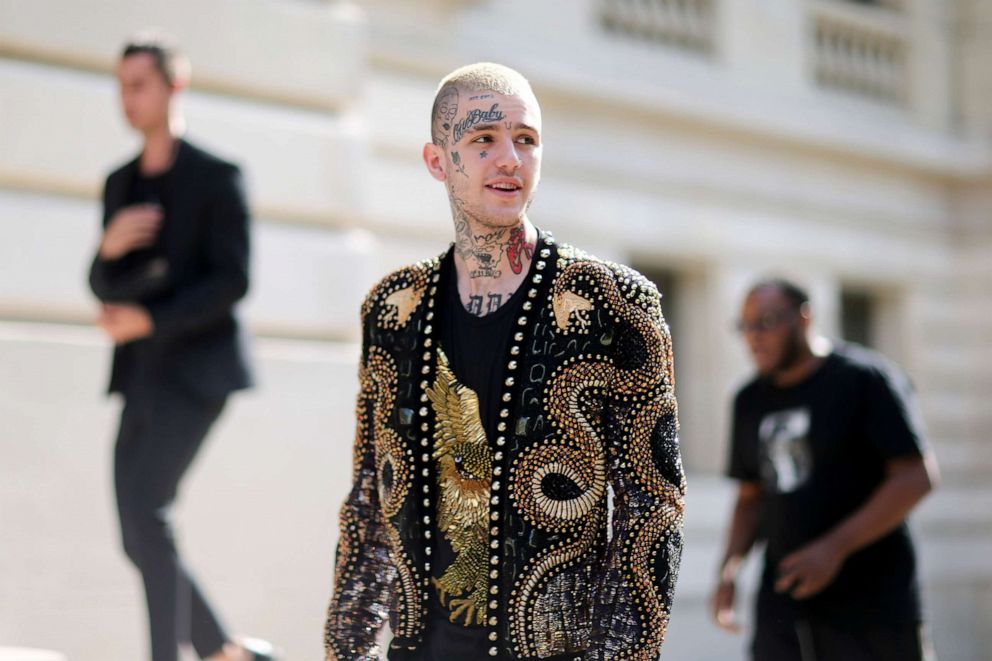 PHOTO: Lil Peep attends the Balmain Menswear Spring/Summer 2018 show as part of Paris Fashion Week, June 24, 2017, in Paris.