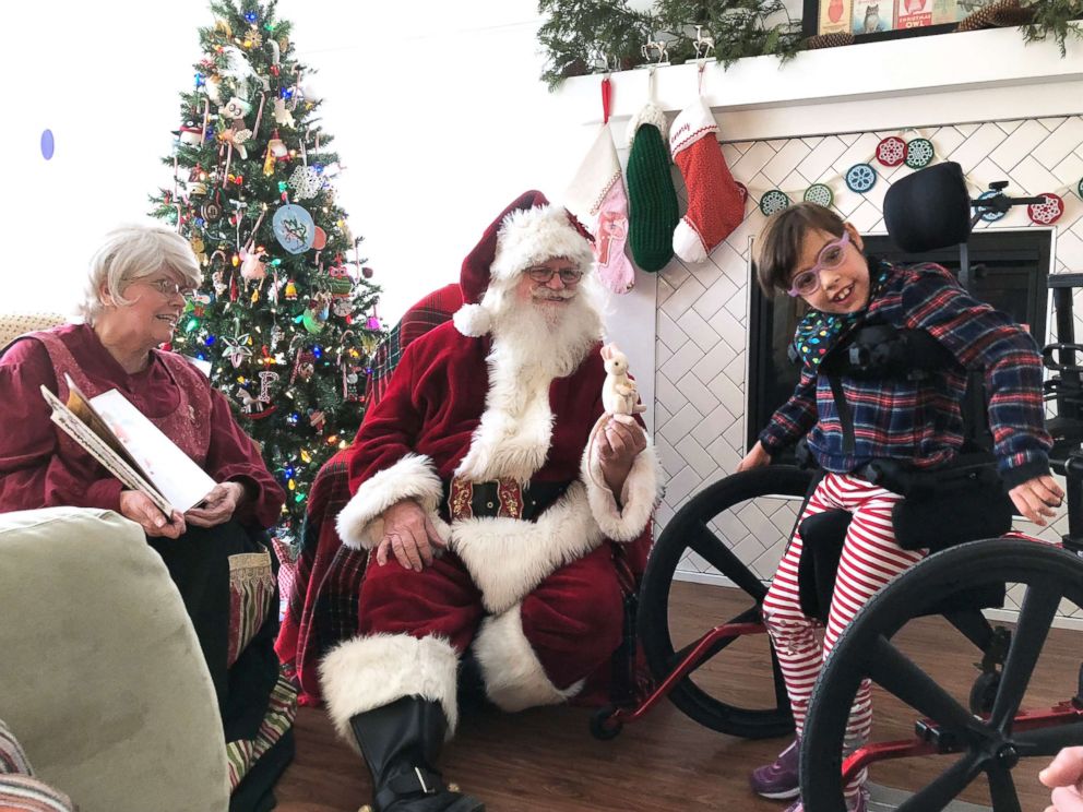 PHOTO: Penelope Widholm gets a visit from Santa in 2017.