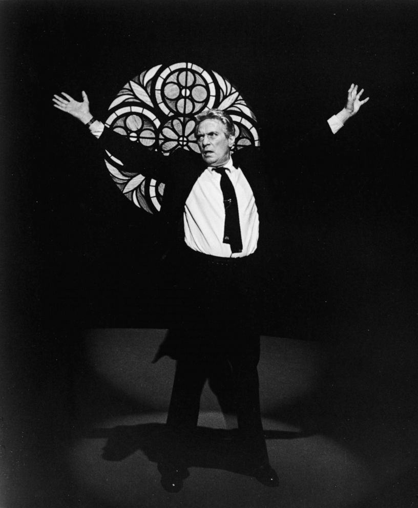 PHOTO: British-born actor Peter Finch raises his arms and stands in front of a stained glass window in a still from the 1976 film, "Network," directed by Sydney Lumet.