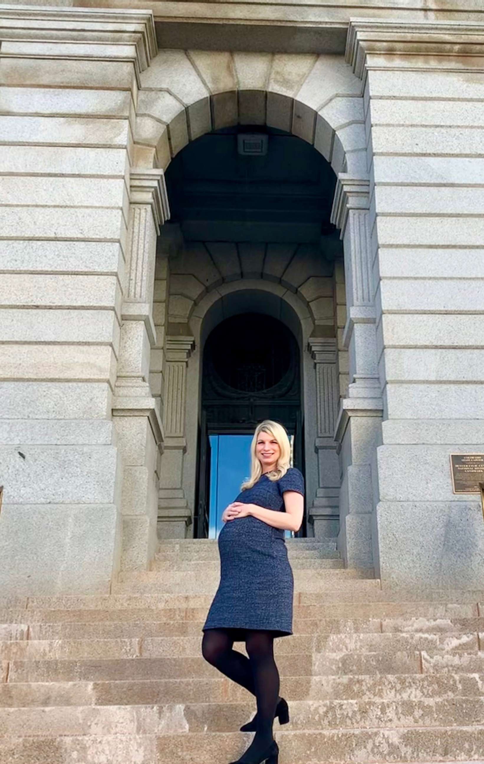PHOTO: Colorado State Sen. Brittany Pettersen poses in front of the state capitol building in Denver during her pregnancy.