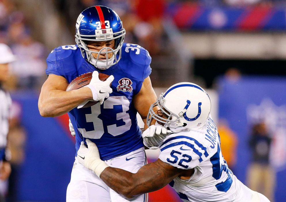 PHOTO: Peyton Hillis of the New York Giants in action against D'Qwell Jackson of the Indianapolis Colts Nov. 3, 2014, at MetLife Stadium in East Rutherford, New Jersey.