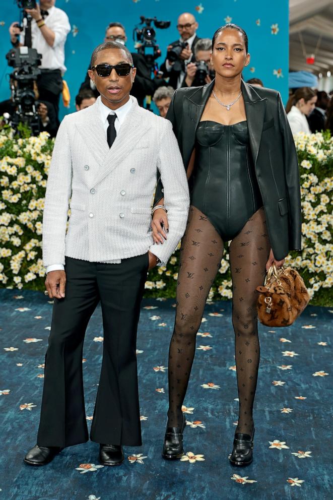 PHOTO: Pharrell Williams and Helen Lasichanh attend the 2025 Met Gala Celebrating "Superfine: Tailoring Black Style" at Metropolitan Museum of Art on May 05, 2025 in New York City.