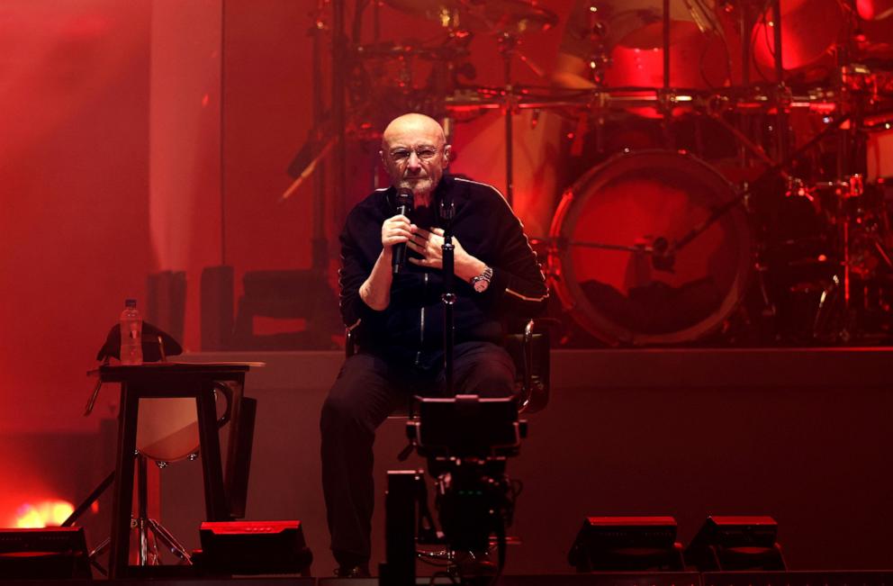 PHOTO: In this March 16, 2022, file photo, British singer Phil Collins performs on stage during "The last domino" tour of the British rock band Genesis at the Paris La Defense Arena, in Nanterre, northeastern France.