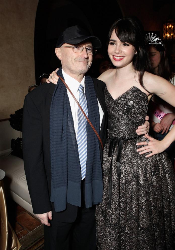 PHOTO: Musician Phil Collins and Actress Lily Collins attend the after party for Relativity Media's "Mirror Mirror" Los Angeles premiere at the Roosevelt Hotel on March 17, 2012 in Hollywood.