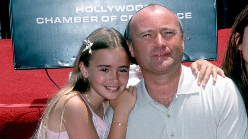 PHOTO: Phil Collins and daughter Lily Collins attend Phil Collins Receives Walk of Fame Star on June 16, 1999 in Hollywood.