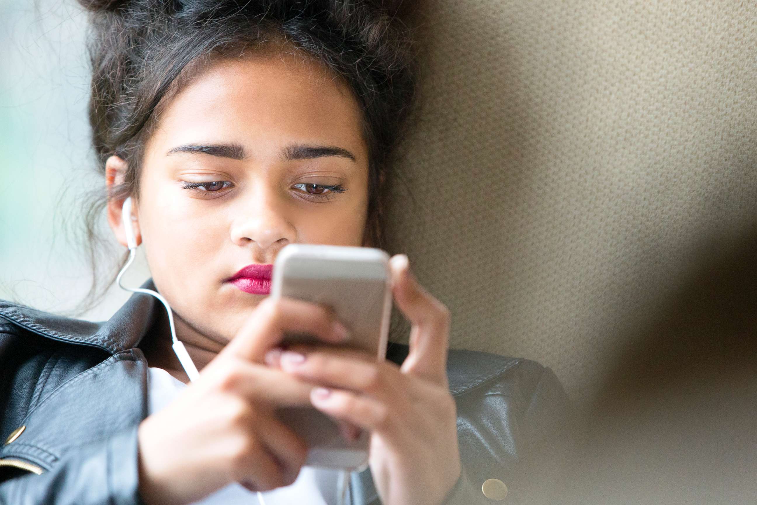 PHOTO: A stock image of a teenage girl looking at her phone.