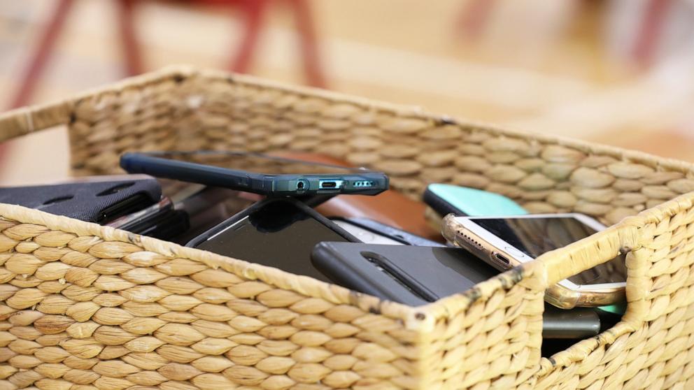 PHOTO: Cell phones put a way in a basket in this undated stock photo.