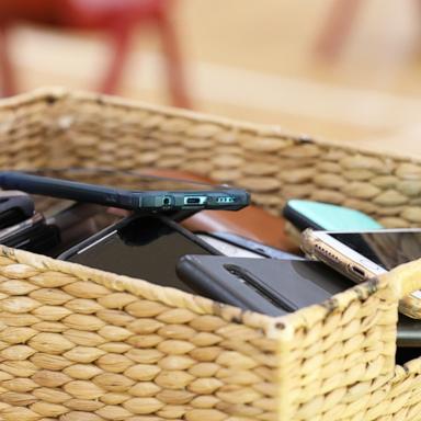 PHOTO: Cell phones put a way in a basket in this undated stock photo.