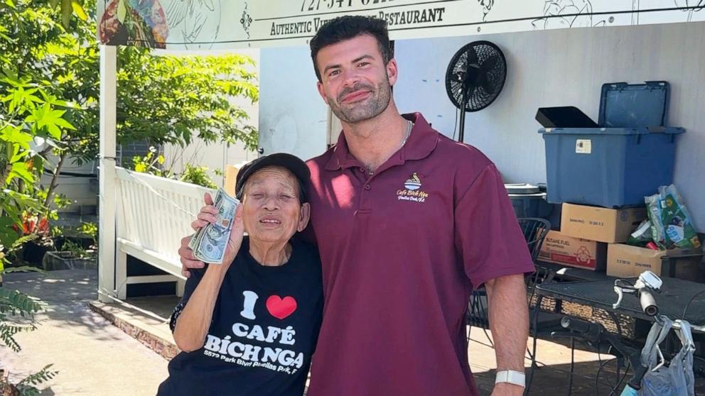 PHOTO: Mrs. Lieng poses with Julian Becerra, whose viral video helped raise more than $200,000 and secure a new home for the beloved Florida restaurant owner.