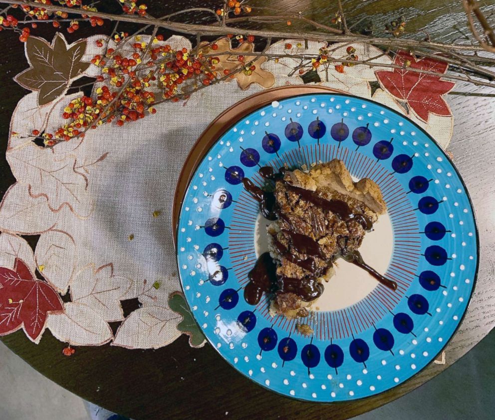 PHOTO: A slice of pecan pie with dark chocolate bourbon sauce.