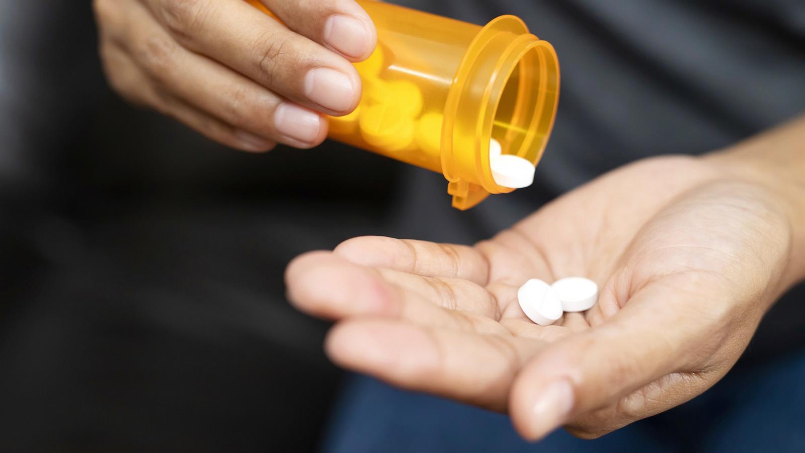 PHOTO: In this undated stock photo, a person is seen pouring pills into their hand.