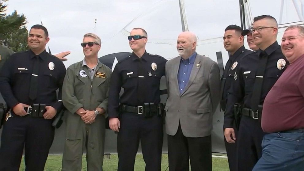 PHOTO: California pilot Mark Jenkins, 70, center, reunited with Los Angeles police officers who rescued him following a plane crash in January. 