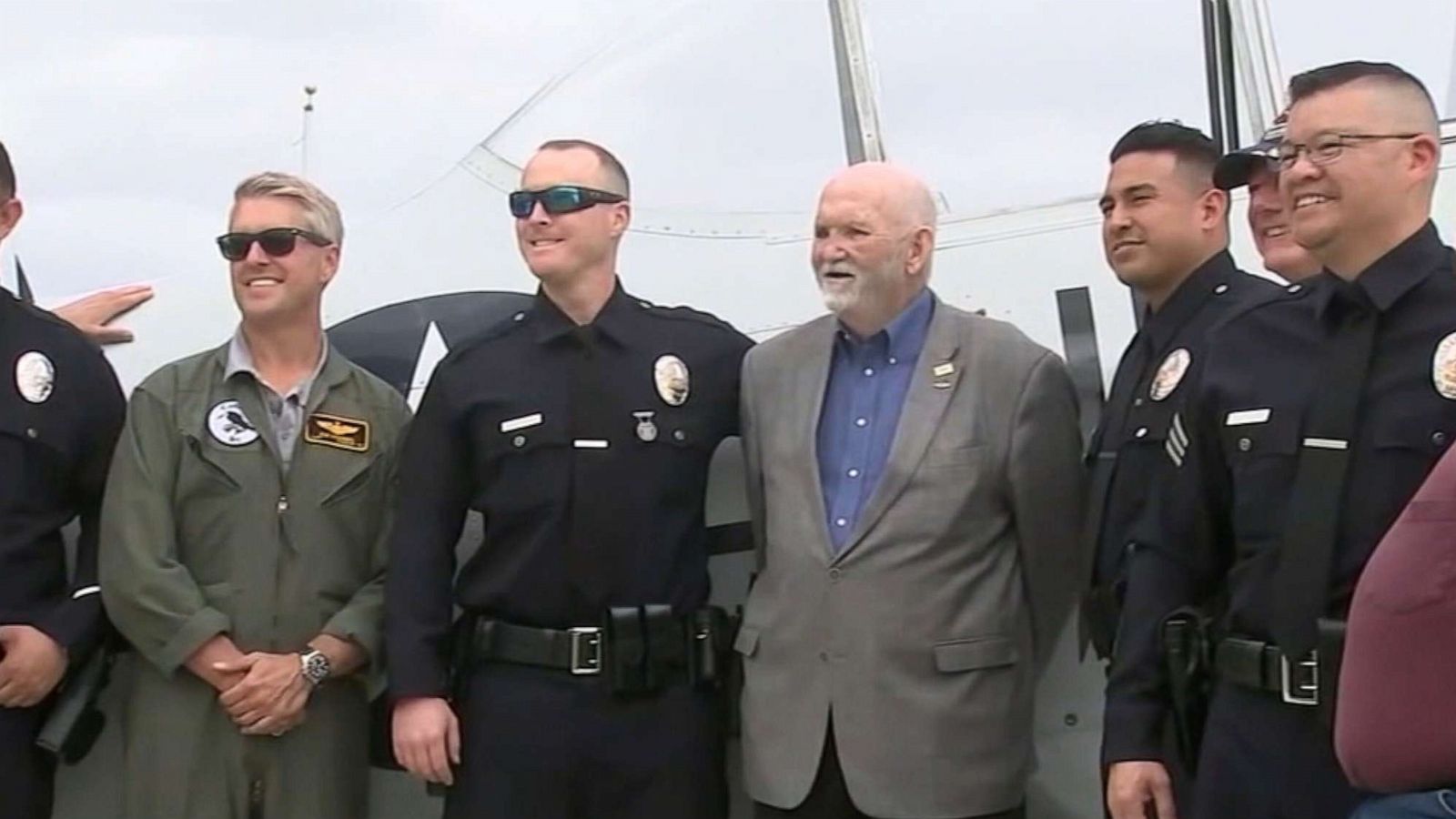 PHOTO: California pilot Mark Jenkins, 70, center, reunited with Los Angeles police officers who rescued him following a plane crash in January.