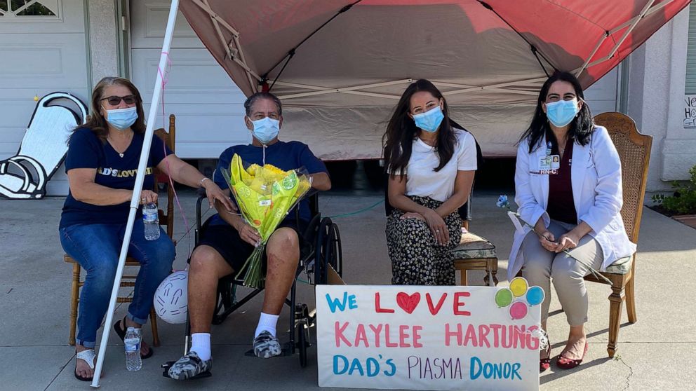 PHOTO: Kaylee Hartung poses for a photo with her plasma recipient, Daniel Macias, a COVID-19 survivor, his wife, Maritza, and his nurse, Lisa Diaz.