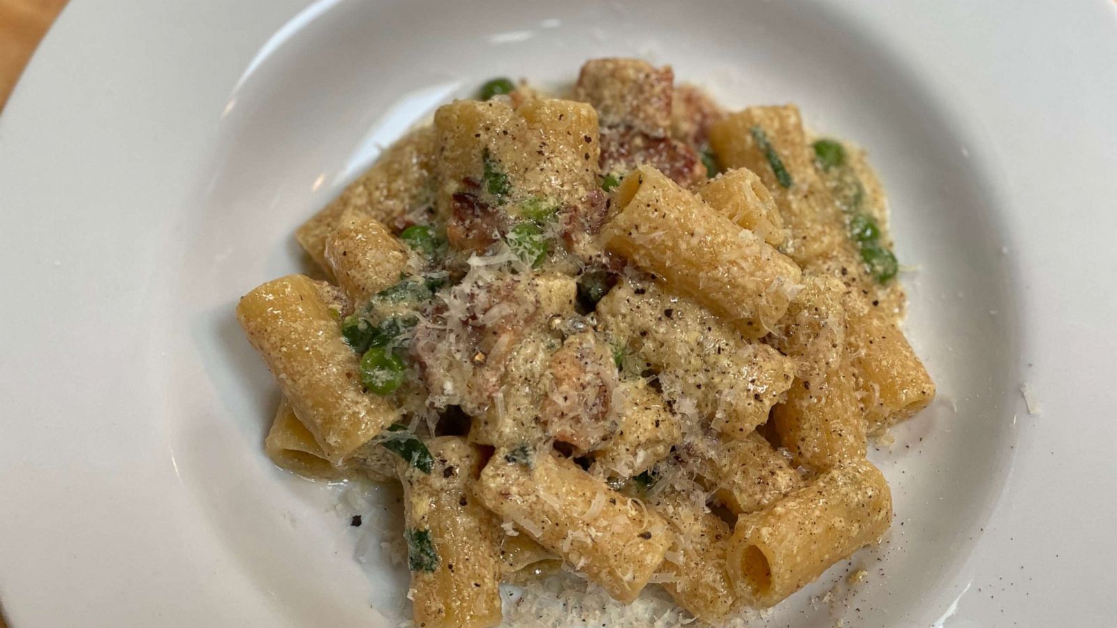 PHOTO: Rigatoni pasta with peas, bacon and a parmesan egg sauce.